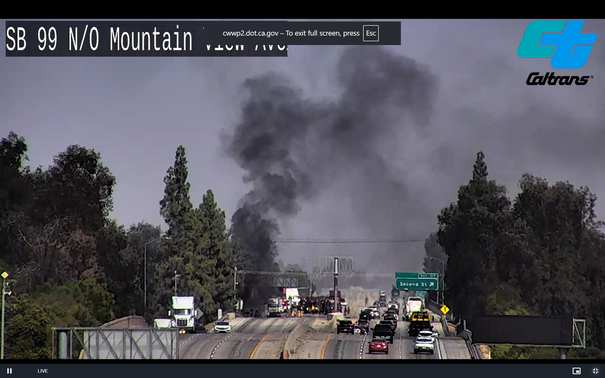 A fuel tanker carrying 8,600 gallons caught fire after a crash with a box truck on southbound Highway 99 at Second Street on Saturday, Aug. 8. 2026, in Selma, California.